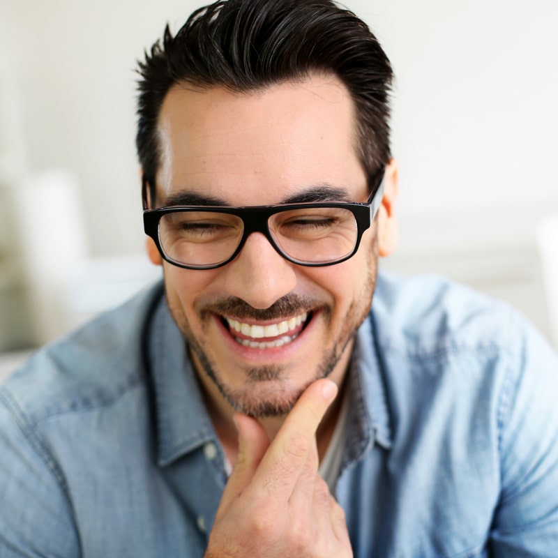 Man in glasses happily smiling